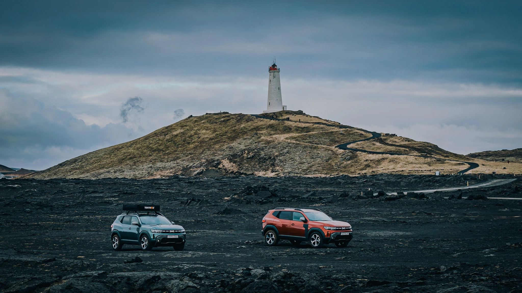 Family enjoying a road trip by the car at sunset
